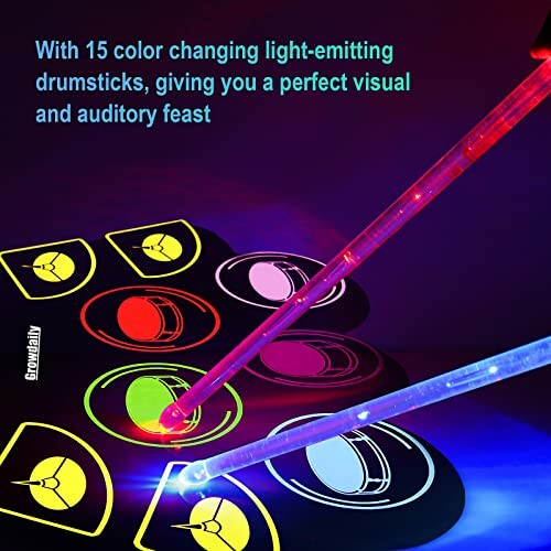 Color-changing light-emitting drumsticks on drum pads.