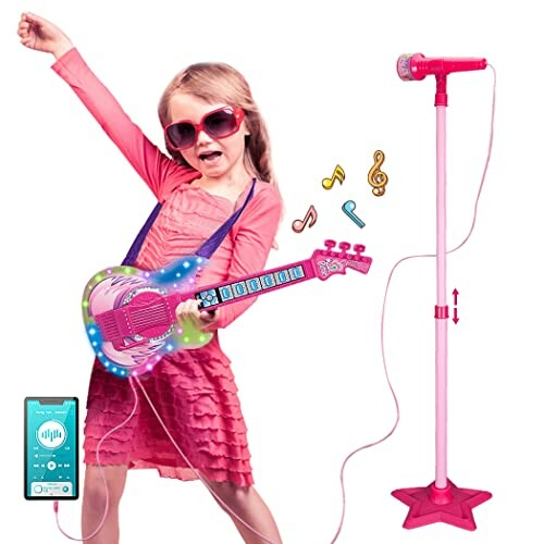 Child playing with toy guitar and microphone stand