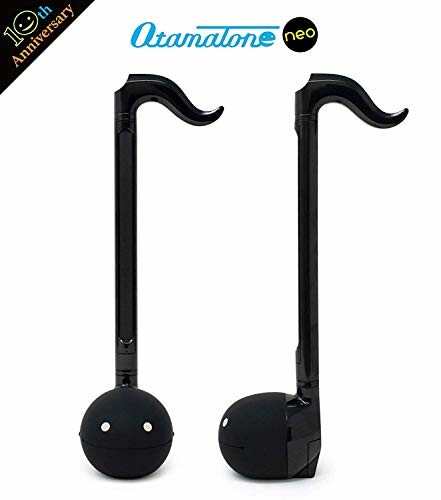 Two black Otamatone musical instruments with smiling faces.