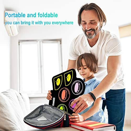 Man and child setting up a portable foldable dart board in a room.