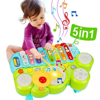 Toddler playing with colorful 5-in-1 musical toy.